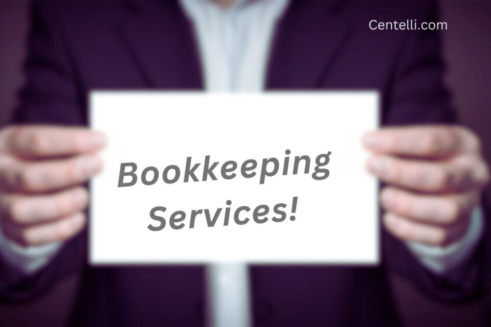 Executive holding out a card advertising bookkeeping services.