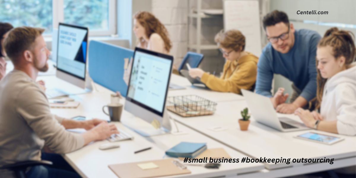 Accountants and bookkeepers working at computers in a small business office.